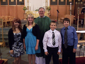Pastor Elkin with confirmands Theoron Hershey,  Max Hospes, Katelyn Lauer, and Hannah Lynn.
