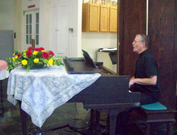 Pastor Elkin playing for the hymn sing-a-long after lunch