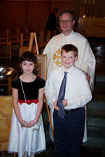 Emily Newcomer and Riley Weber with Pastor Elkin
