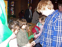Greeting the congregation after the service.