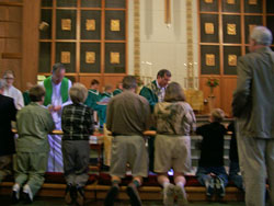 Bishop Drieson giving communion