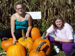 Posing with pumpkins