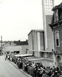 The congregation processes from the old St. Mark's to the new - February 28, 1960