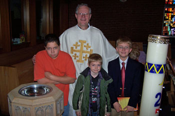 Pastor Elkin with the young men celebrating the milestones