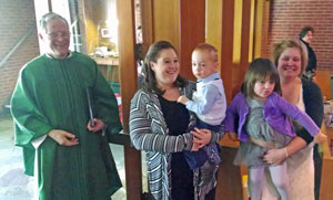 Breanna and Jonathan greeting the congregation