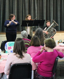 Sara, Laura and Trey play for the Women's & Children's dinner