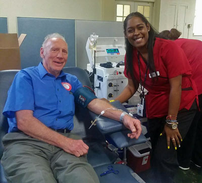 Lou DeSeau giving blood