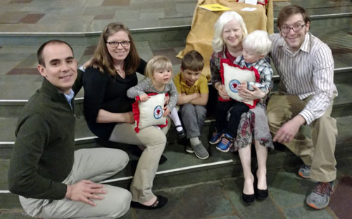 The Comerford and Applegate families with their prayer pillows