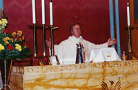 Pastor Walter L. Brandau, preparing for communion