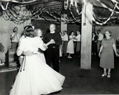 Pastor Houser square dancing in the church basement